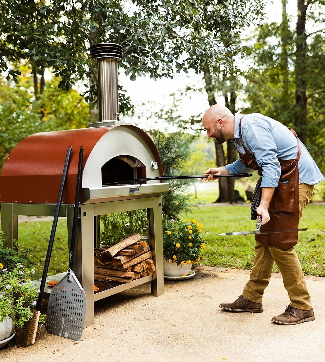 Cooking in an outdoor pizza oven