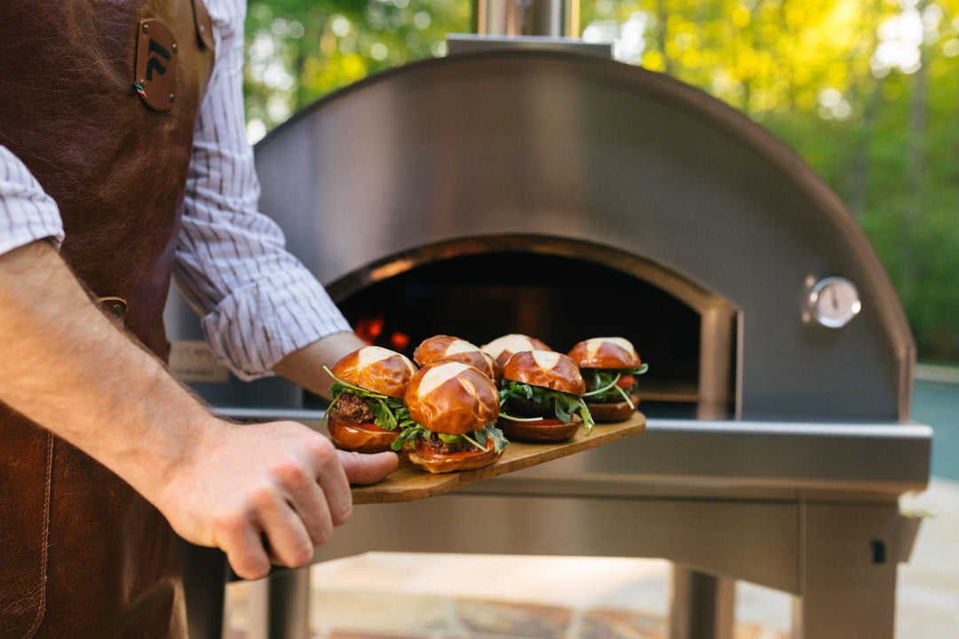 Cooking sliders in a portable outdoor pizza oven from Fontana Forni