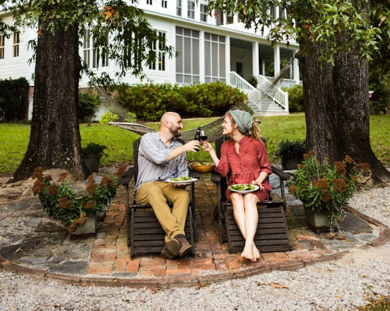 Couple celebrating their wedding anniversary over homemade pizza