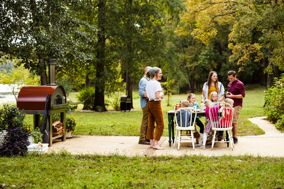 Fontana Forni pizza oven being used at a housewarming party