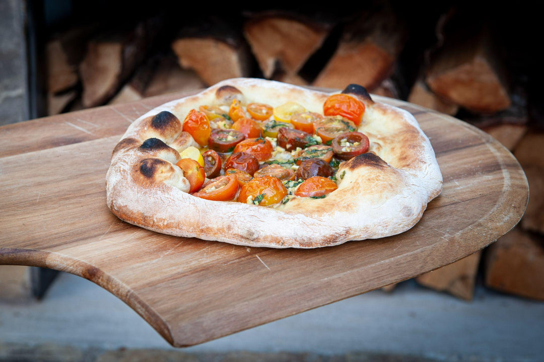 hot fresh traditional italian pizza on wooden table