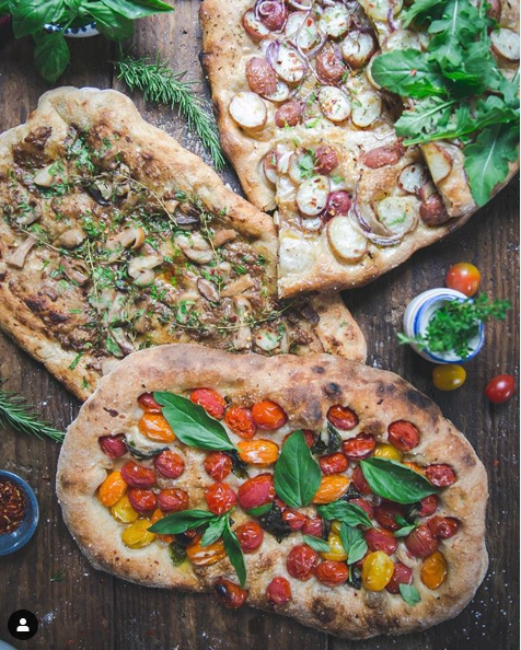 Naan pizza on wooden background
