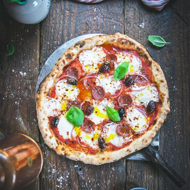 Pizza with mozzarella and basil leaves 