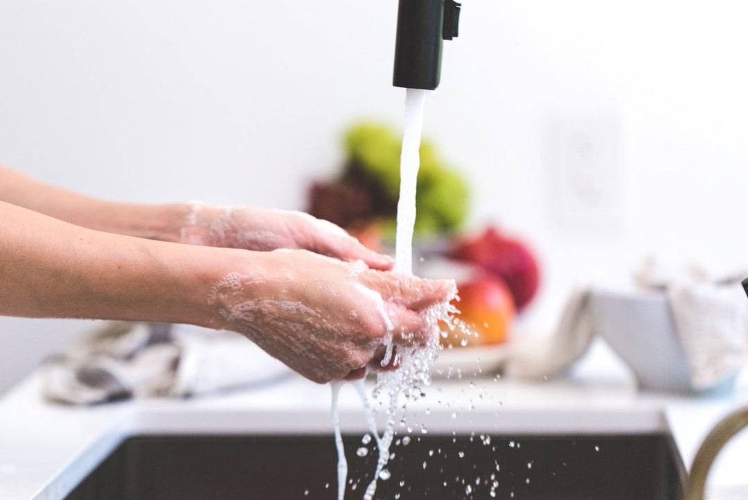 woman washes his hands with soap at home. concept virus protection.