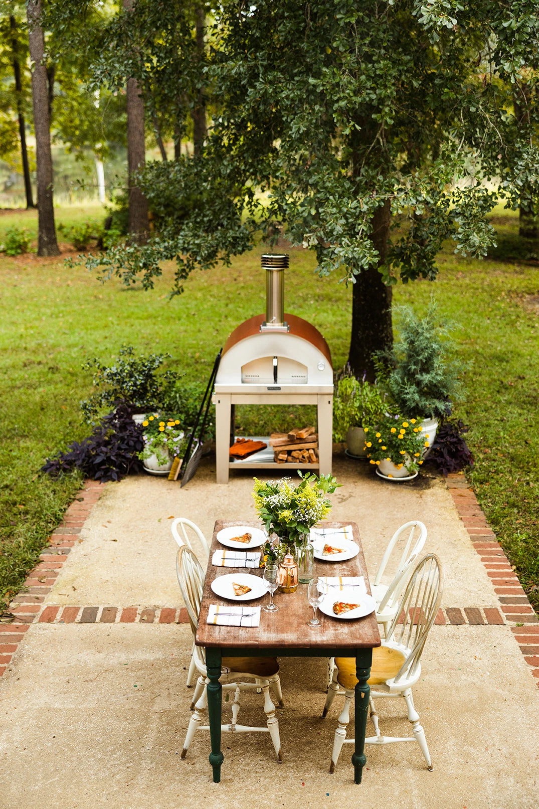 Marinara Wood-Fired Oven Next to an Outdoor Table 