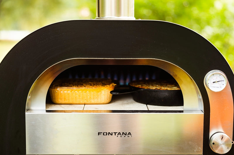 Food Being Made in a Maestro 60 Gas Mini Portable Outdoor Pizza Oven