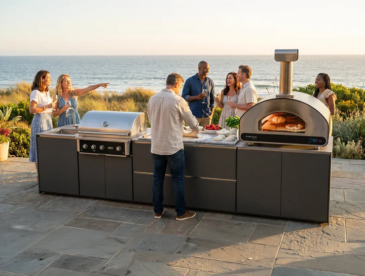 ember outdoor kitchen friendly get together by the coast - making pizza