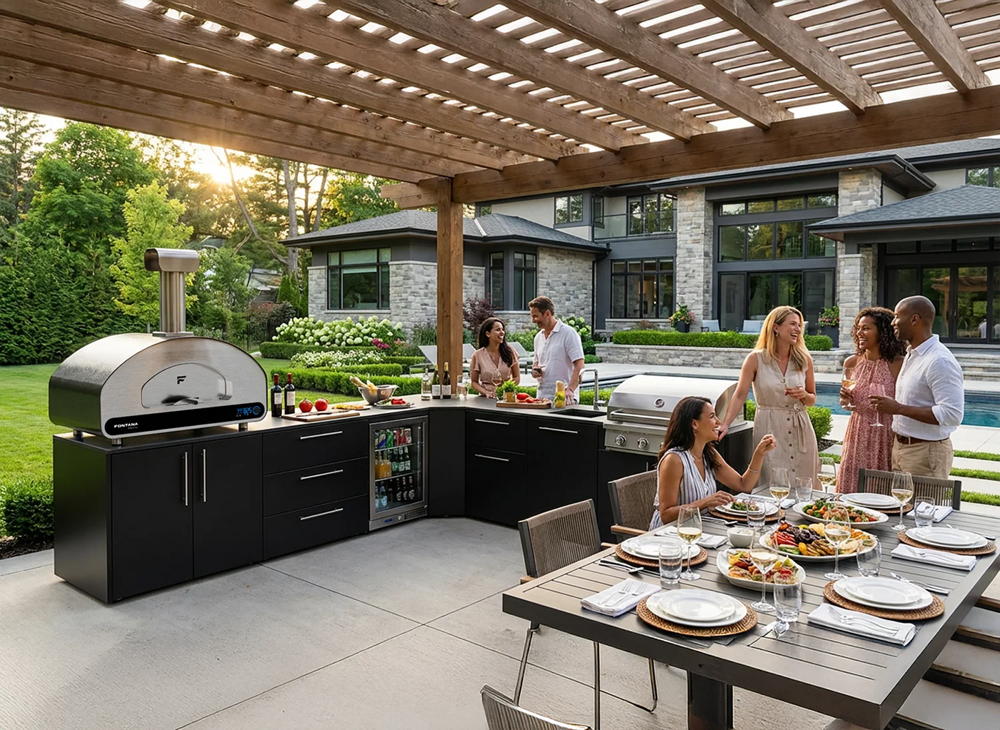 Group of friends around the Elysia outdoor kitchen with Volta and a grill.