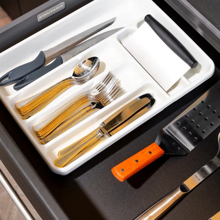 Open drawer of Elysia module with white tray holding cutlery and utensils with Fontana name plate inside drawer
