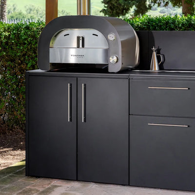 Maestro oven on top of Elysia Oven Module paired with storage module and wall panels on patio