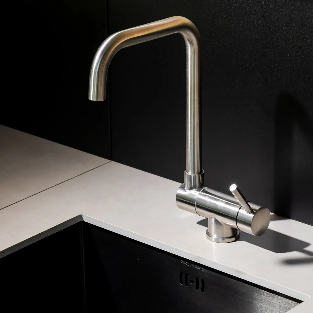 Close up of silver sink over under-mount sink and light countertop of Elysia Sink Module