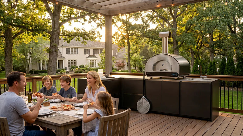 ember outdoor kitchen family on deck eating pizza together