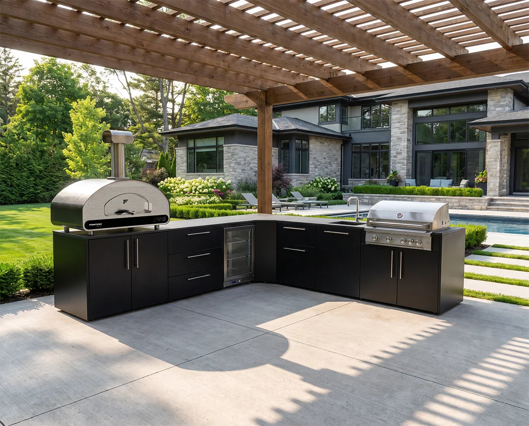 Group of friends around the Elysia outdoor kitchen with Volta and a grill.