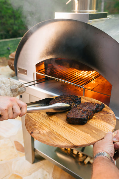 Forno Toscano Stainless Steel Grill With Steaks Going on It