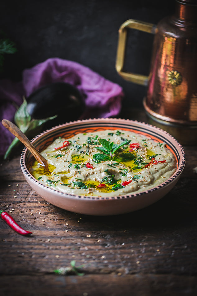 Olive Oil Drizzle on Dip From a Copper Oil Cruet